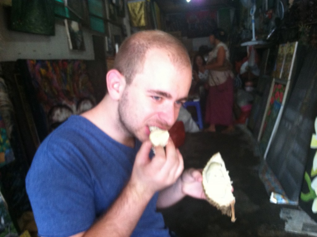 Adam trying durian for the first time. 